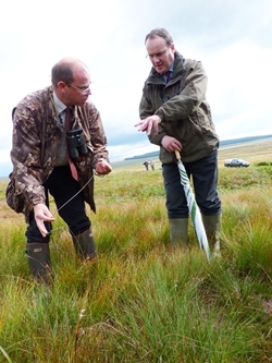 Minister for Environment Paul Wheelhouse (right) with Project Manager Graeme Dalby, discussing the efficacy of moorland management techniques on Langholm Moor