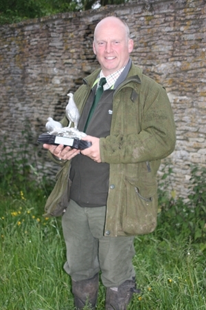 David Wiggins, gamekeeper receives the GWCT’s Grey Partridge Trophy on behalf of the Englefield Estate in recognition of the inspiring conservation efforts being carried out for the benefit of wild grey partridges