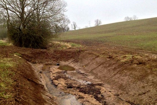 Figure 2: Bunded ditches, an earth bank inserted into a ditch with a small pipe to slow the flow of water and encourage the sediment to settle Figure 2: Bunded ditches, an earth bank inserted into a ditch with a small pipe to slow the flow of water and encourage the sediment to settle