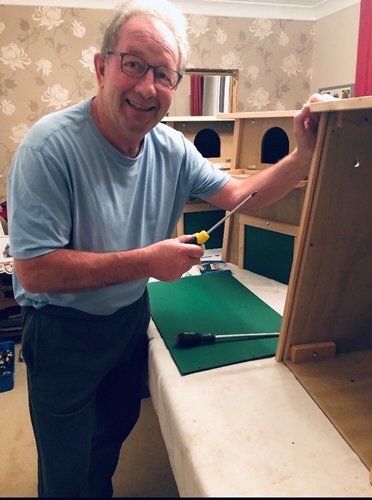 Jimmy working from home constructing nest boxes for the Owl Box Initiative.