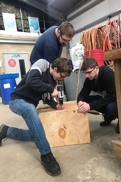 Sparsholt College students constructing barn owl boxes with the GWCT