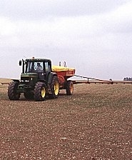 Tractor spreading fertiliser