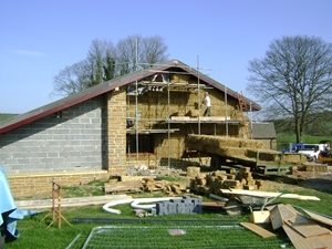 The straw bales provide excellent wall insulation and were harvested from fields within one mile of the site