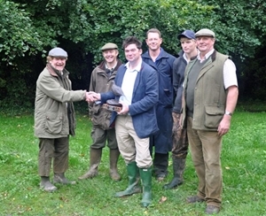 Mike Swan (left) from the Game & Wildlife Conservation Trust presents Lord Cranborne with the GWCT’s Grey Partridge Trophy, which was awarded in recognition of the estate’s team effort to conserve grey partridges