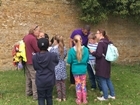 JB Gill joins school children on a visit to a farm.