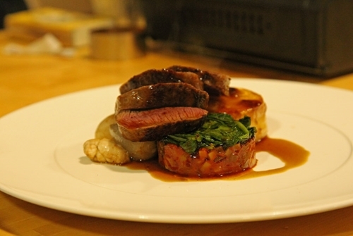 Noisette Of Highland Venison With Roasted Shallots , Sweet Breads , Garlic , Baby Spinach , Honey Fondant And A Thyme Scented Jus